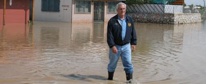 Senator Shapleigh walking through the flooded Mowad area in Canutillo